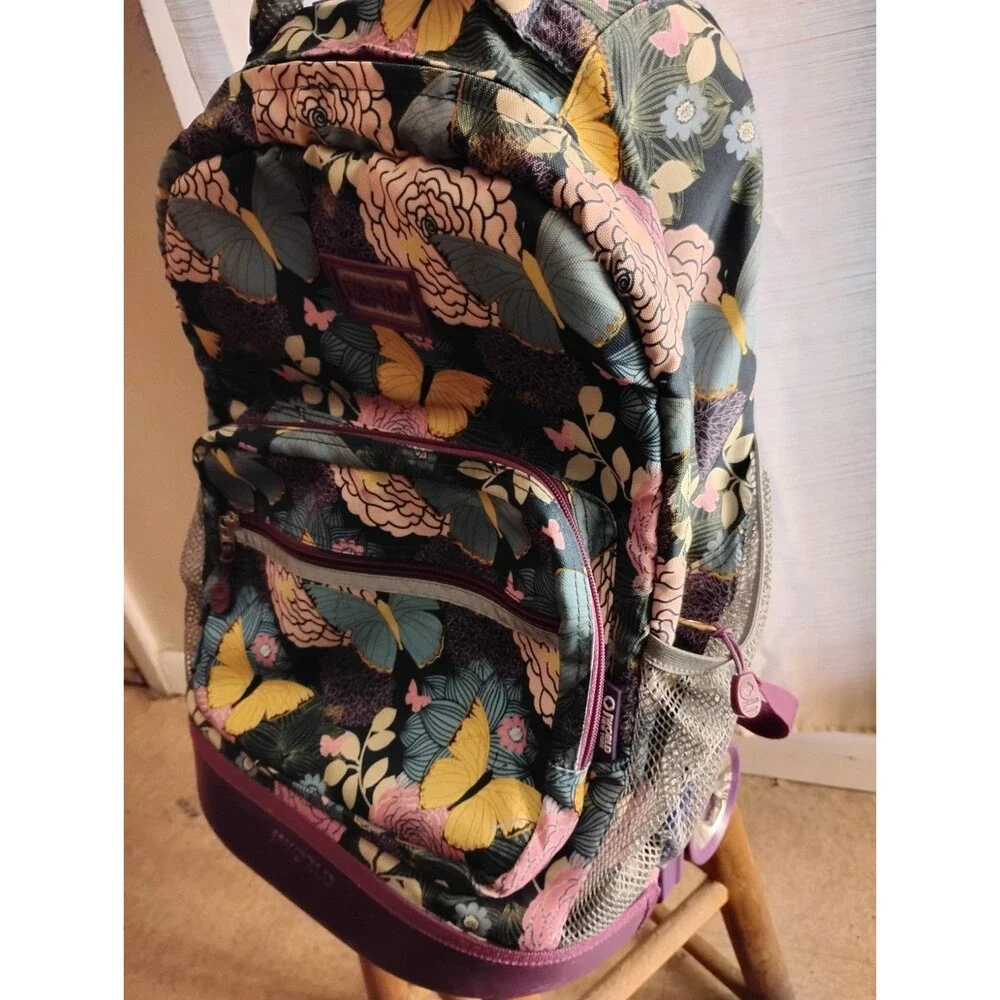 J World New York Rolling Backpack Retractable Handle Mesh Pockets Secret Garden